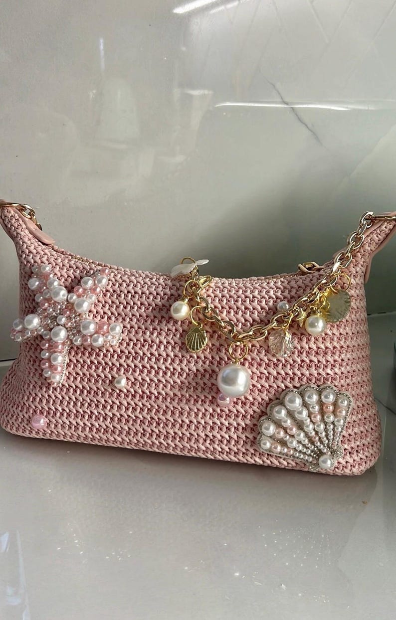 Pink woven seashell bag