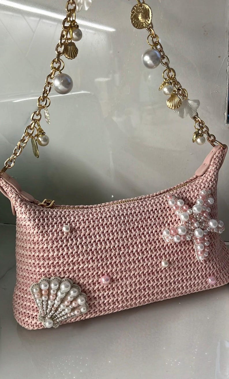 Pink woven seashell bag