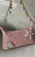 Pink woven seashell bag